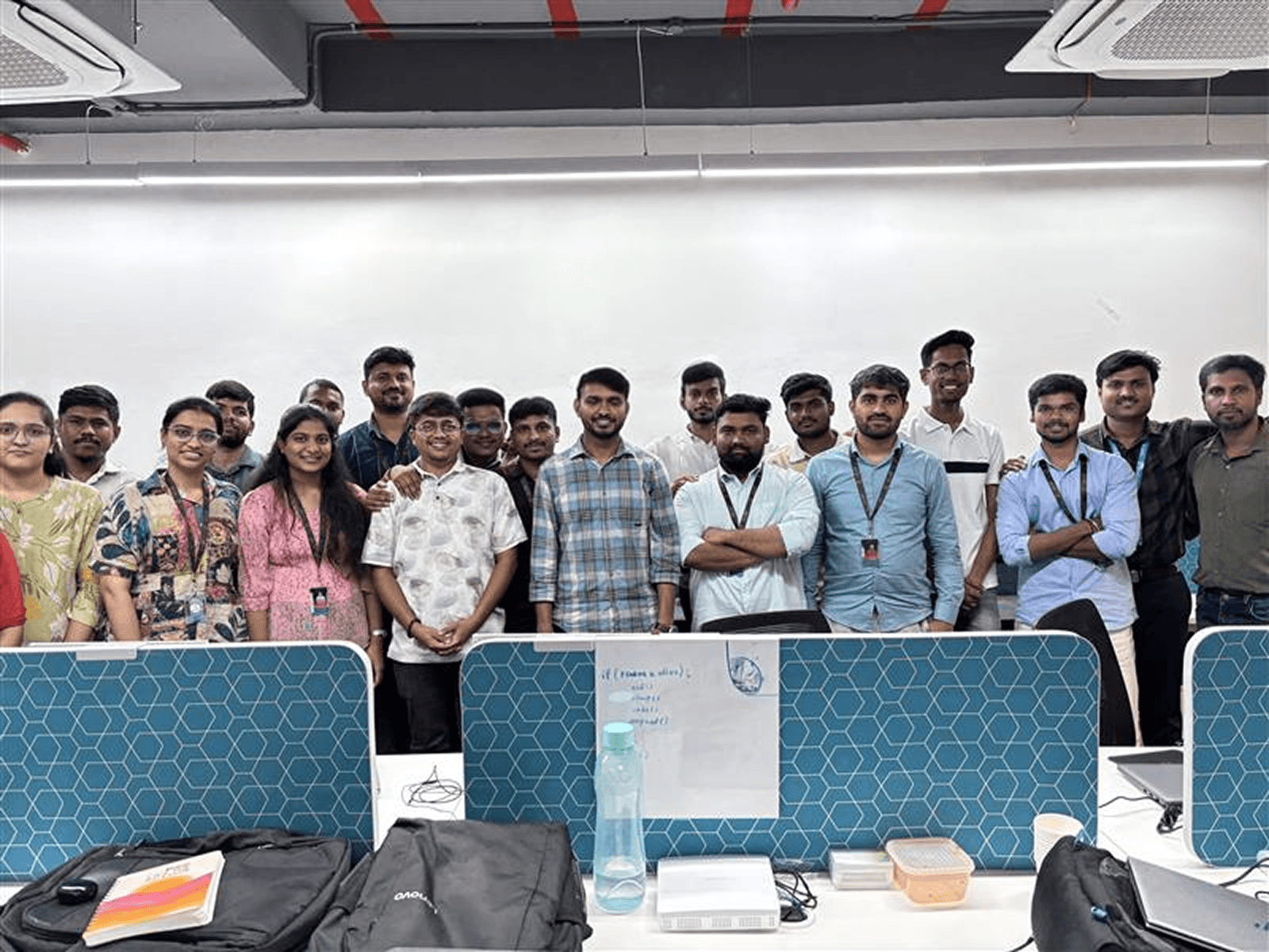 Yukosa team members celebrating together in a modern office space